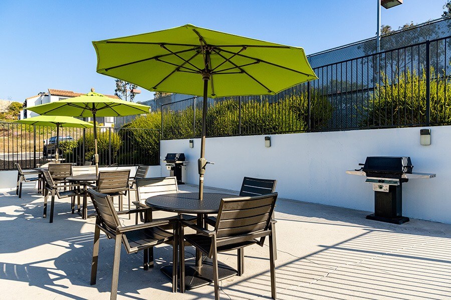Outdoor Grilling Stations and Patio Furniture at Santa Fe Ranch Apartments located in Carlsbad, CA.
