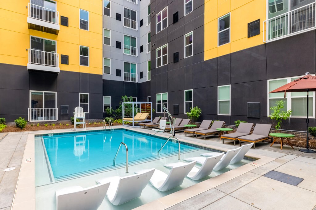 Swimming pool with lounge chairs surrounding