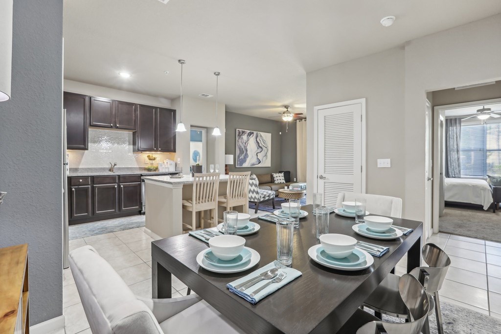 Model dining room with a table set for six.
