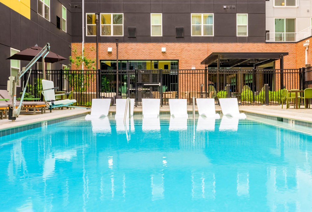 Swimming pool with in-pool loungers