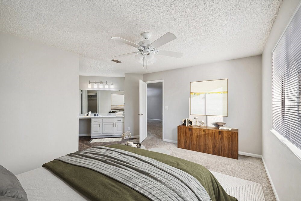 Model Bedroom with Carpet and attached Bathroom at Westland Park Apartments in Jacksonville, FL.