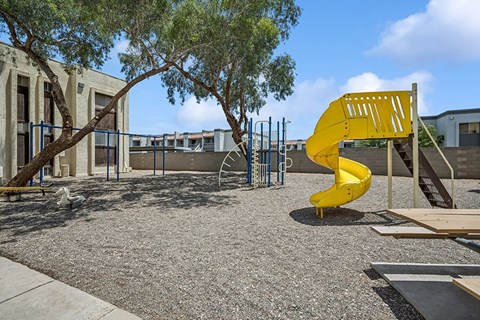 Community Playground and Picnic Tables at Butler Ridge Apartments located in Glendale, AZ.