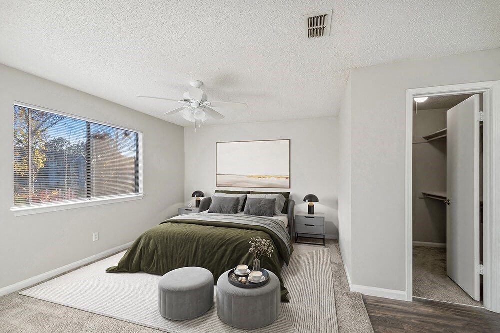 Model Bedroom with Carpet and Walk in Closet at Westland Park Apartments in Jacksonville, FL.