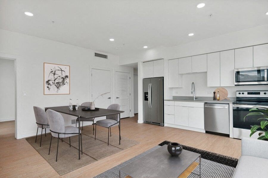 Model kitchen and dining area at 801 Flats located in Post District Residences in downtown Salt Lake City, Utah