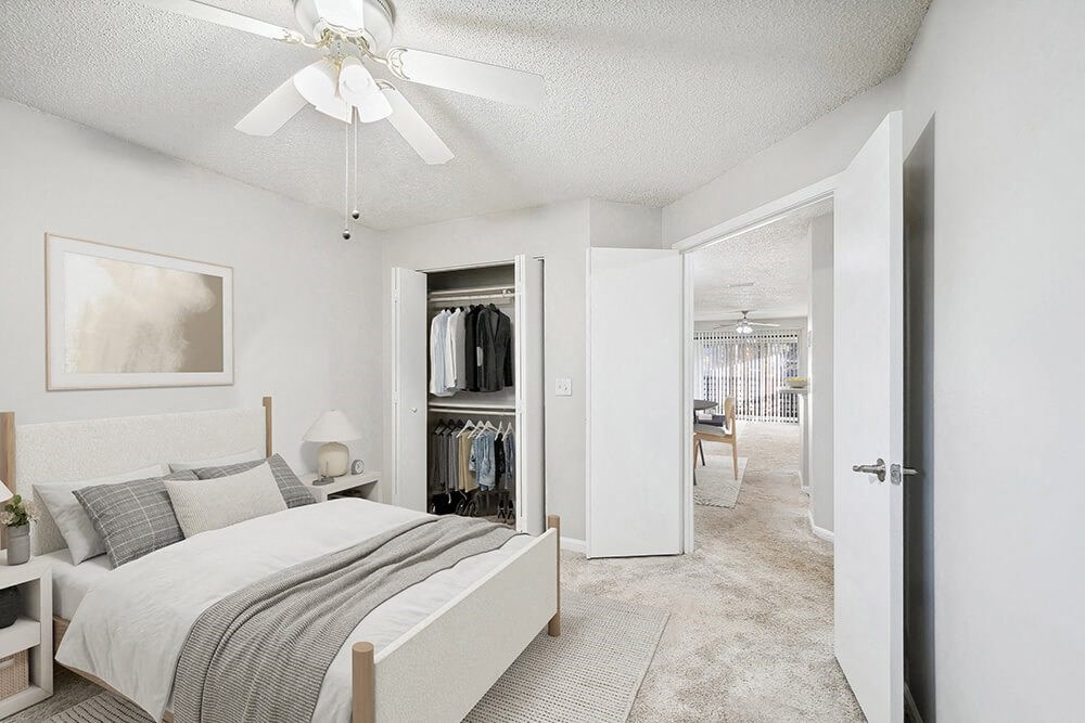 Model Bedroom with Carpet and Closet at Westland Park Apartments in Jacksonville, FL.