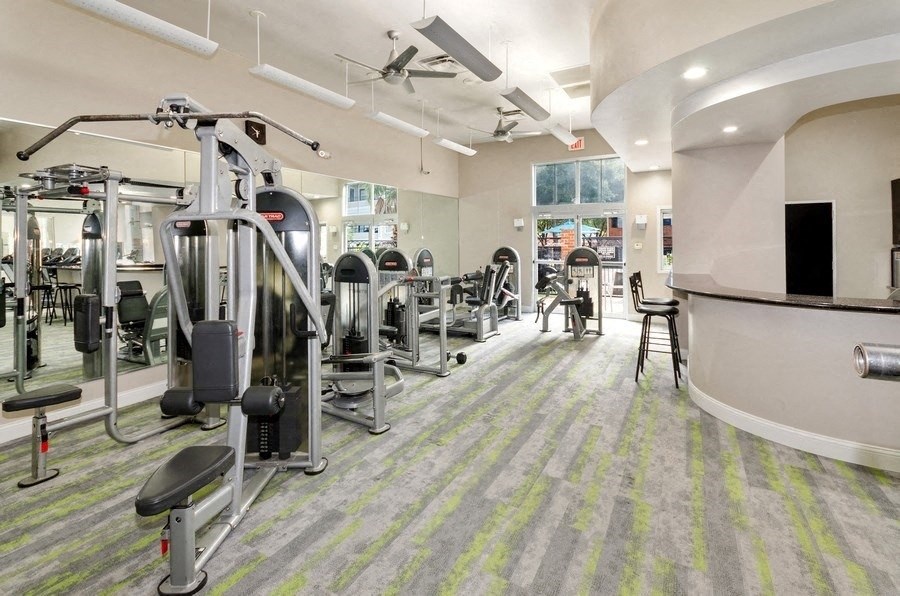 Fitness Center with weight machines and carpeted floors
