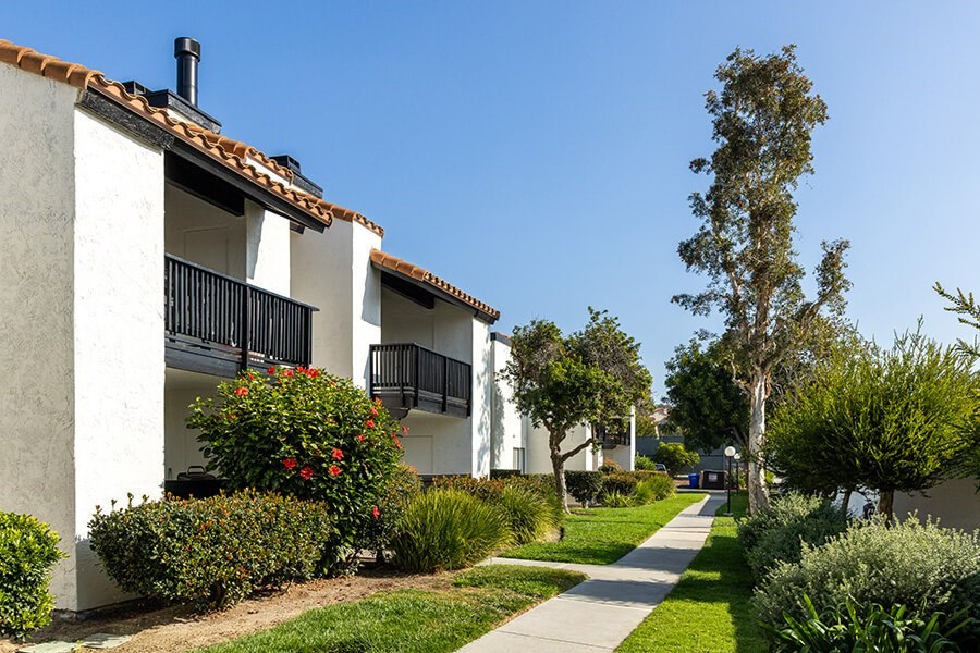 Exterior Community Building with Landscape at Santa Fe Ranch Apartments located in Carlsbad, CA.