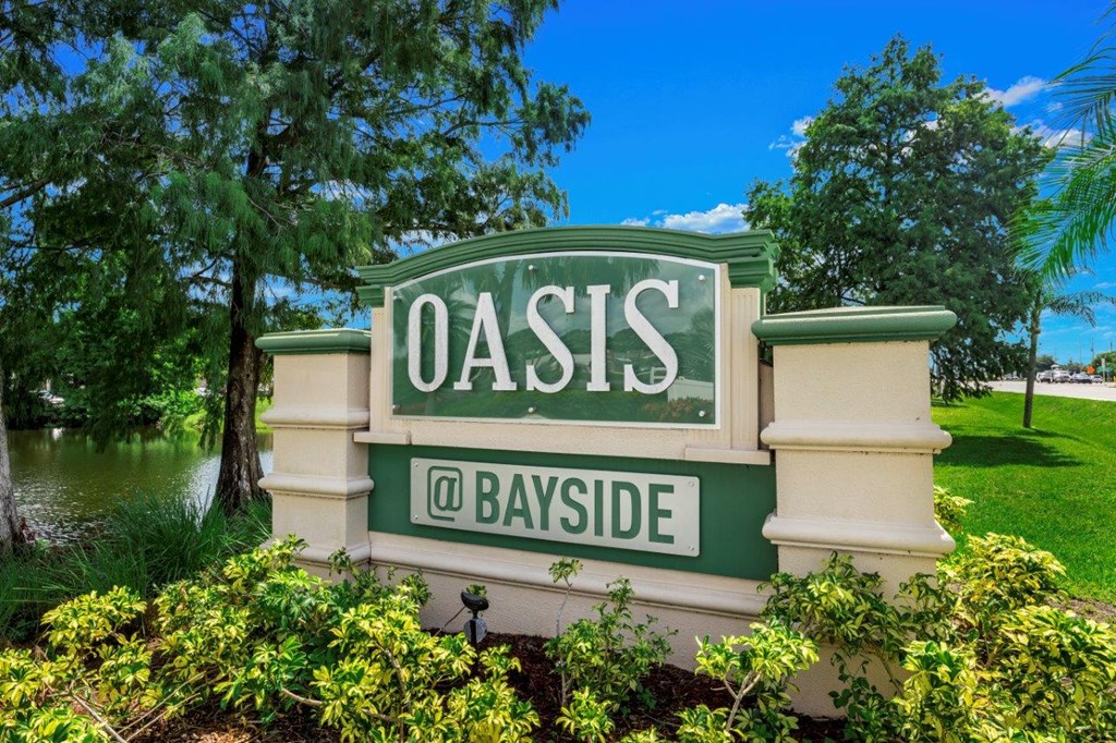 Property sign at Oasis at Bayside Apartments in Largo, FL
