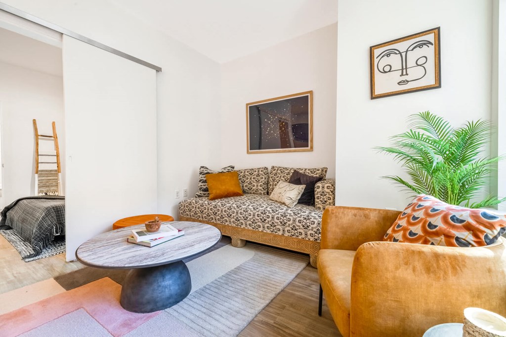 Model living room with a couch and a table