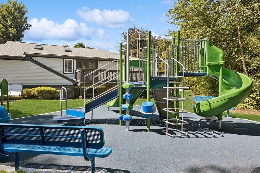 Community Playground with a Slide at Middlesex Crossing Apartments located in Billerica, MA.