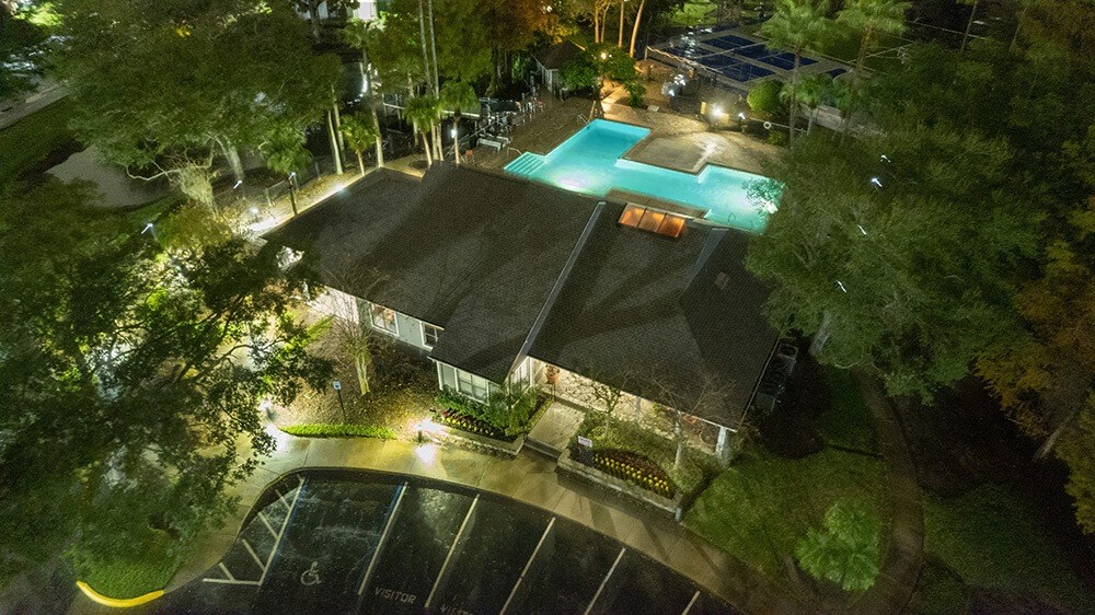 Aerial View of Community Clubhouse and Swimming Pool at Fountains at Lee Vista Apartments in Orlando, FL.