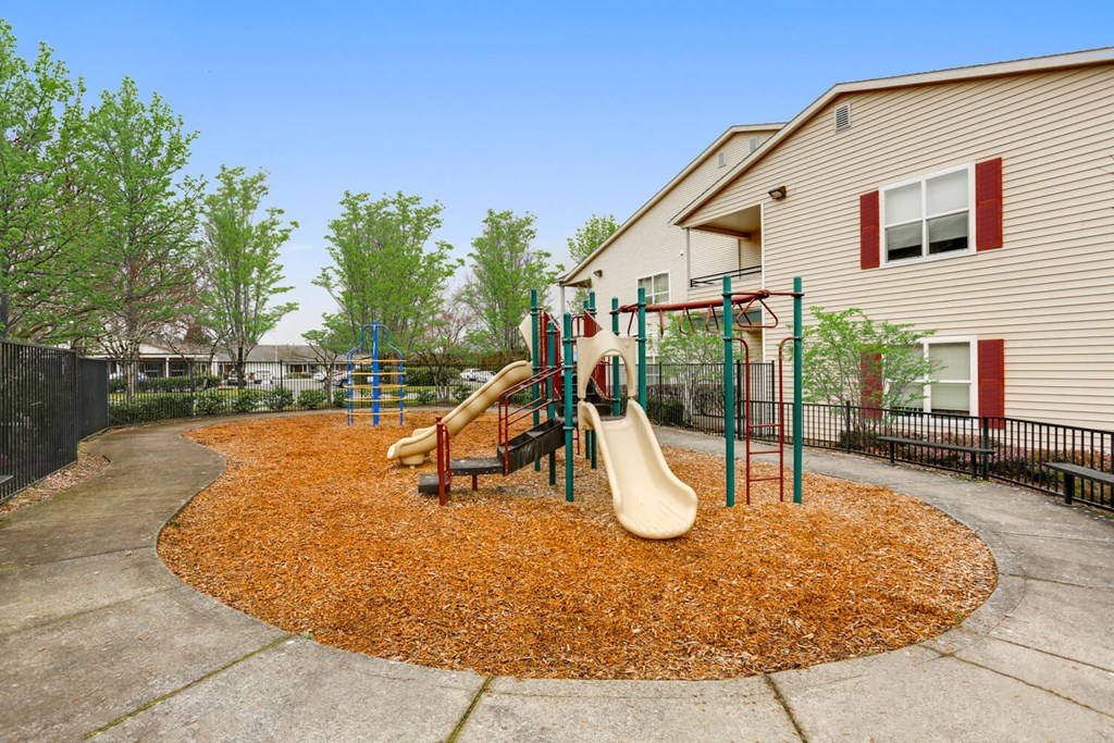 Community Playground with Slide at Landings at Morrison Apartments located in Gresham, OR.