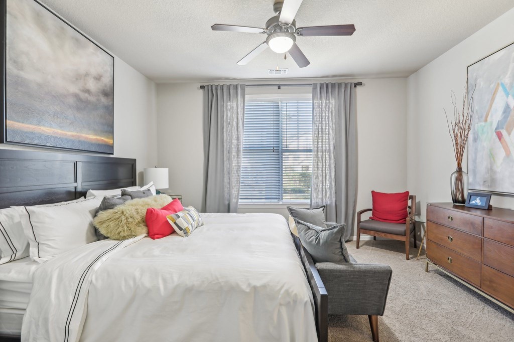 Model bedroom with queen bed.