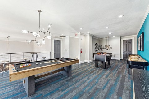 Community Clubhouse with Game Tables at Chapel Hill Apartments located in Lewisville, TX.
