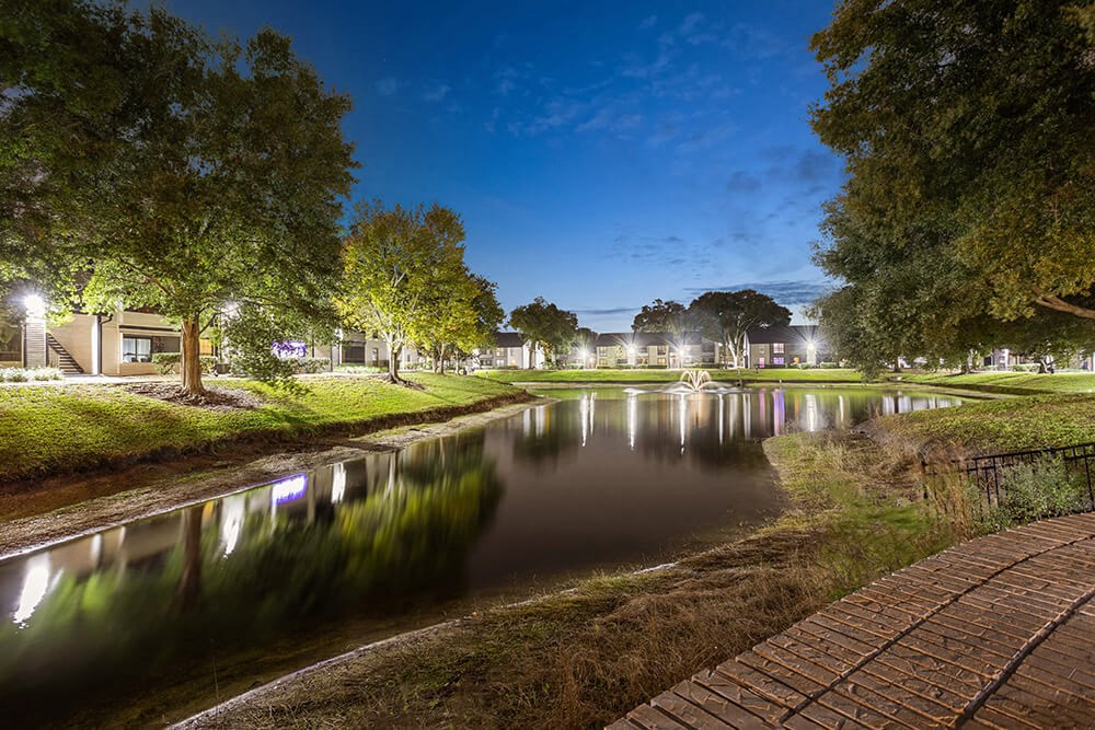 Community Pond and Walking Path at Carrollwood Station Apartments in Tampa, FL.