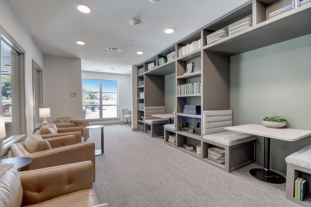 a room filled with furniture and a large window