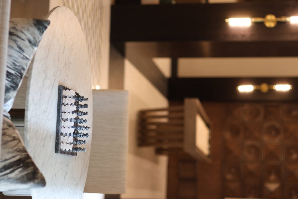 a close up of a sculpture of a surfboard with stairs in the background