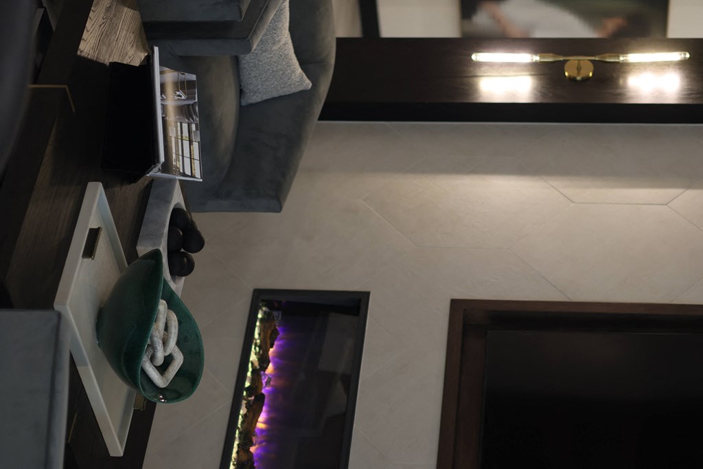 a view from above of a living room with a fireplace and a hat on a