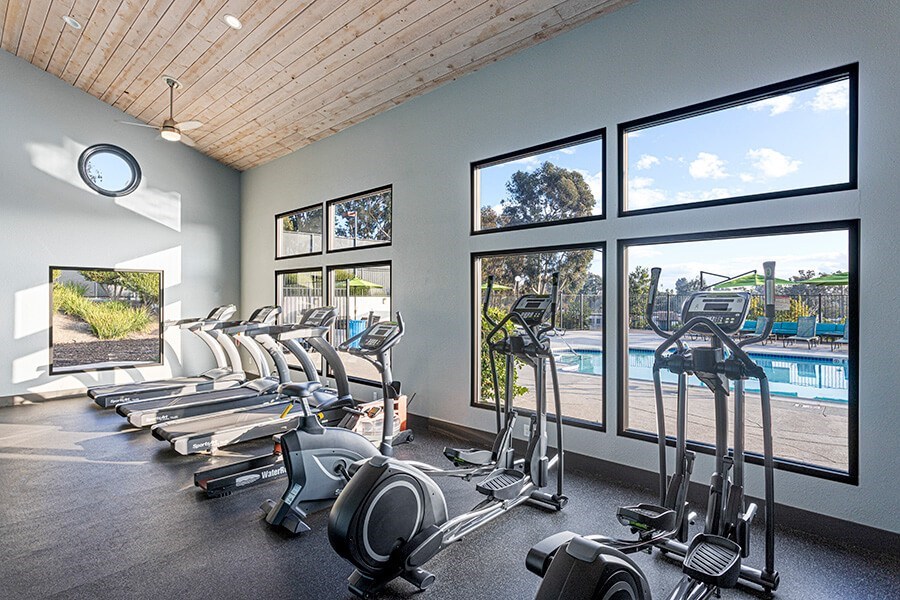 Community Fitness Center with Equipment at Santa Fe Ranch Apartments located in Carlsbad, CA.