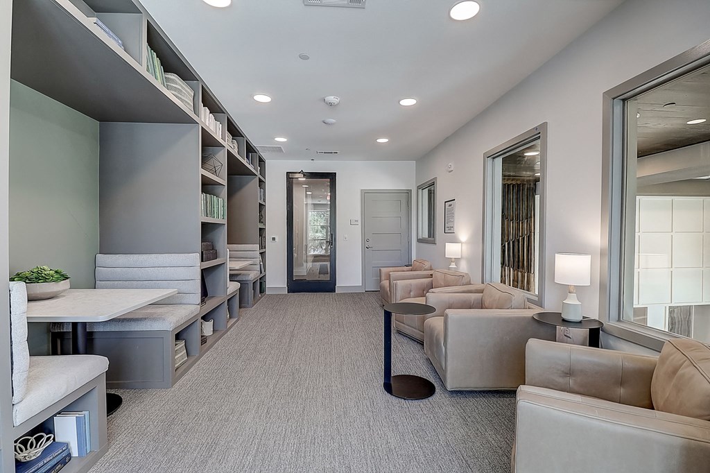 a room filled with furniture and a large window