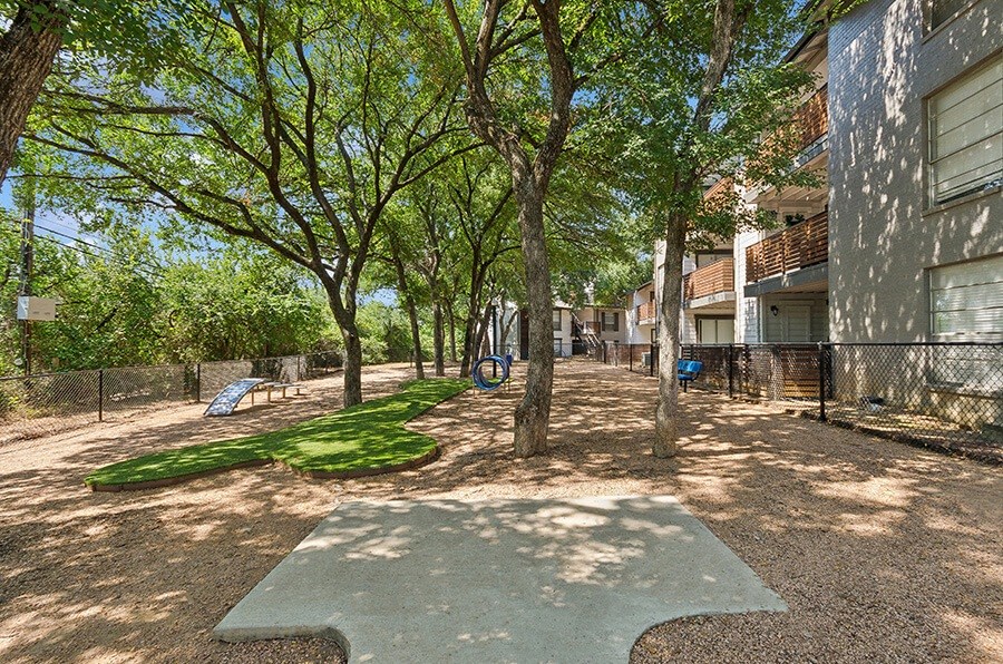 Community Dog Park with Agility Equipment at Woodcreek Apartments located in Arlington, TX.