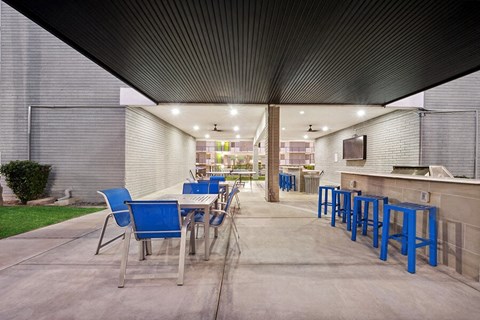 Outdoor BBQ Area with Furniture at Arcadia on 49th Apartments located in Phoenix, AZ.