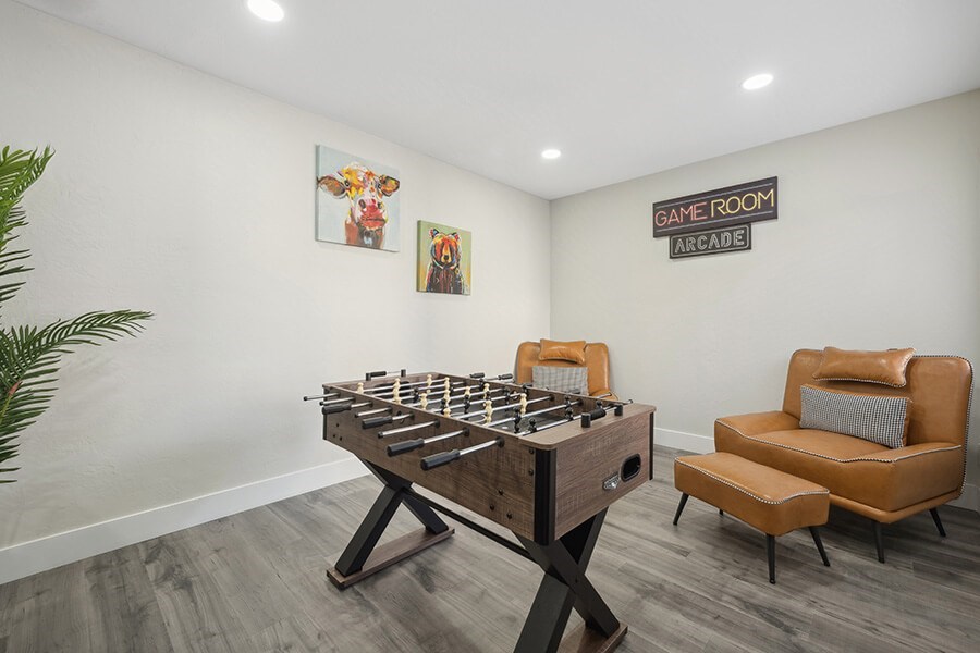 Community Clubhouse with Game Tables and Lounge Furniture at Villages at Metro Center Apartment located in Phoenix, AZ.
