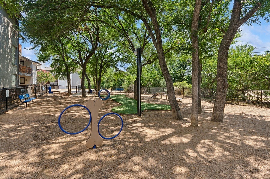 Community Dog Park with Agility Equipment at Woodcreek Apartments located in Arlington, TX.