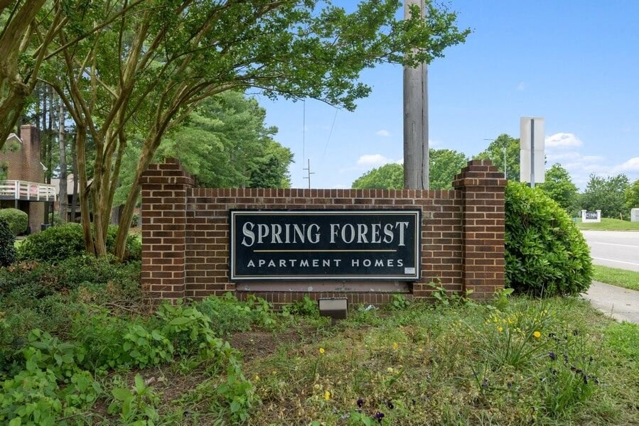 Property entrance sign and landscape