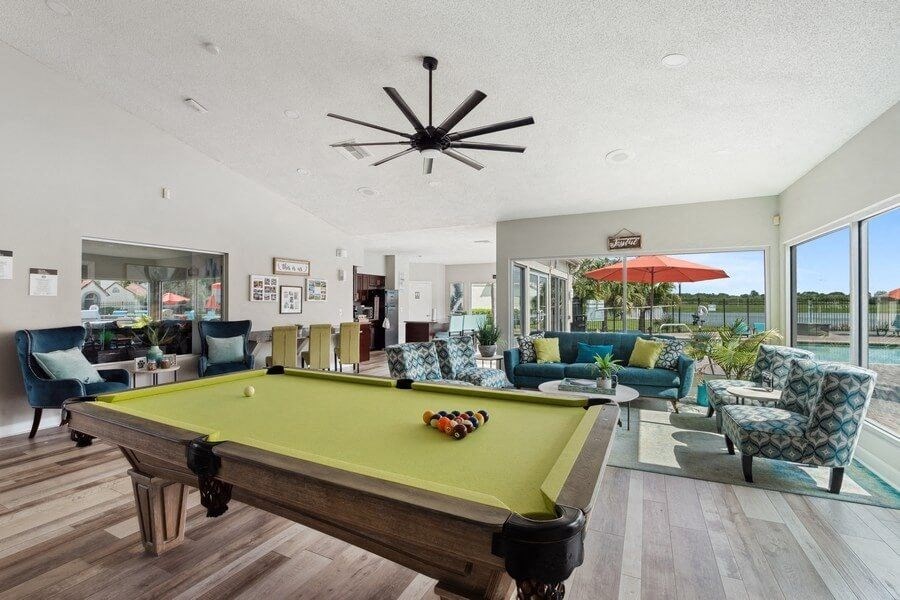 Clubhouse game room with pool table