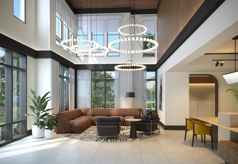 A modern living room with a brown sofa and a large window.