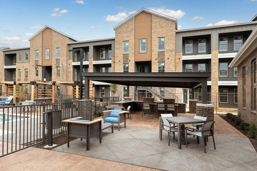 Outdoor lounge space at Alta 3Eighty Apartments in Aubrey, TX