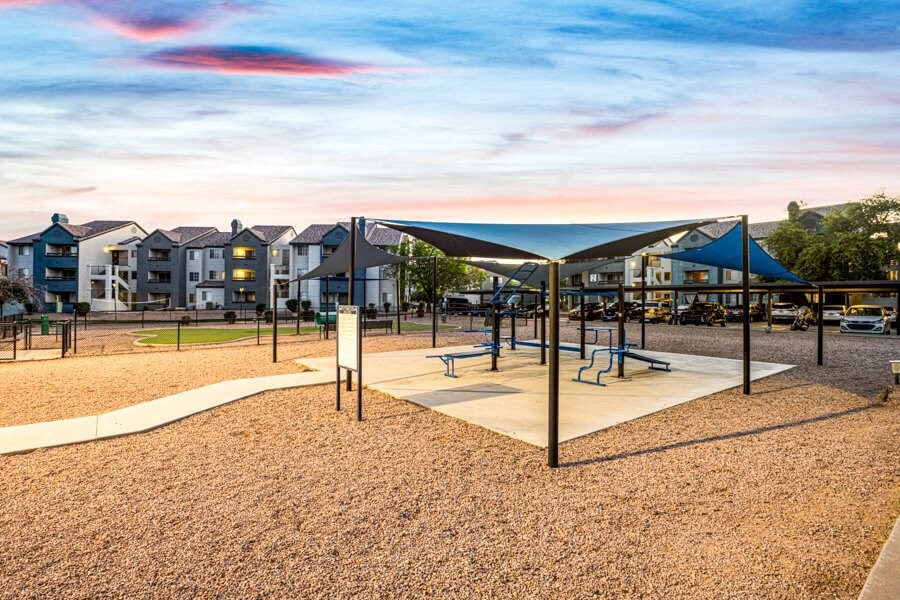 a playground with a pavilion and benches in front of some apartments at Array South Mountain, Phoenix, AZ