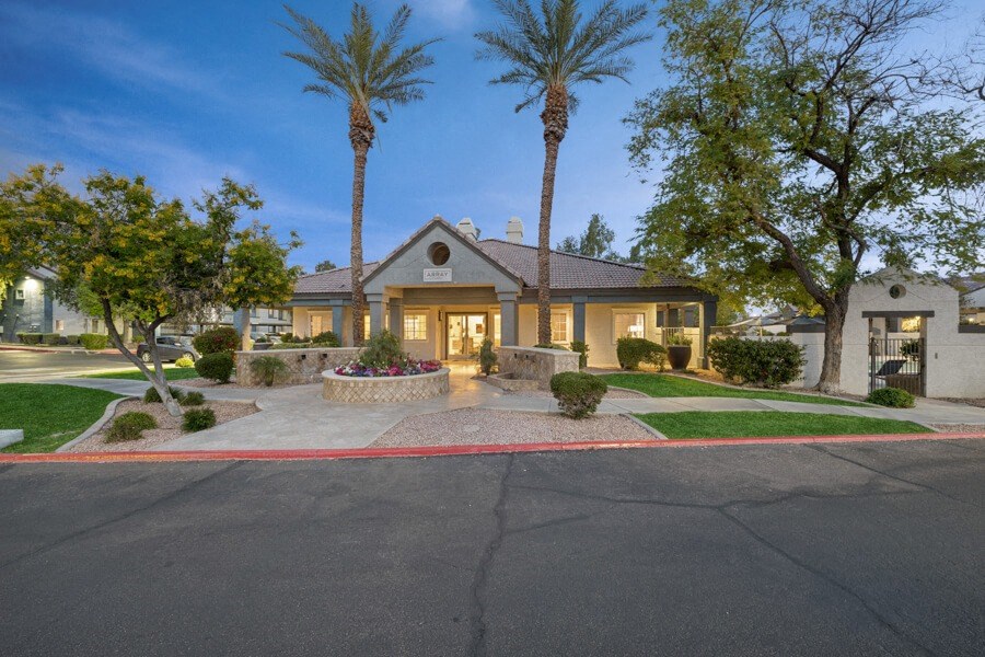 a house with a driveway and palm trees in front of it at Array South Mountain, Phoenix, Arizona