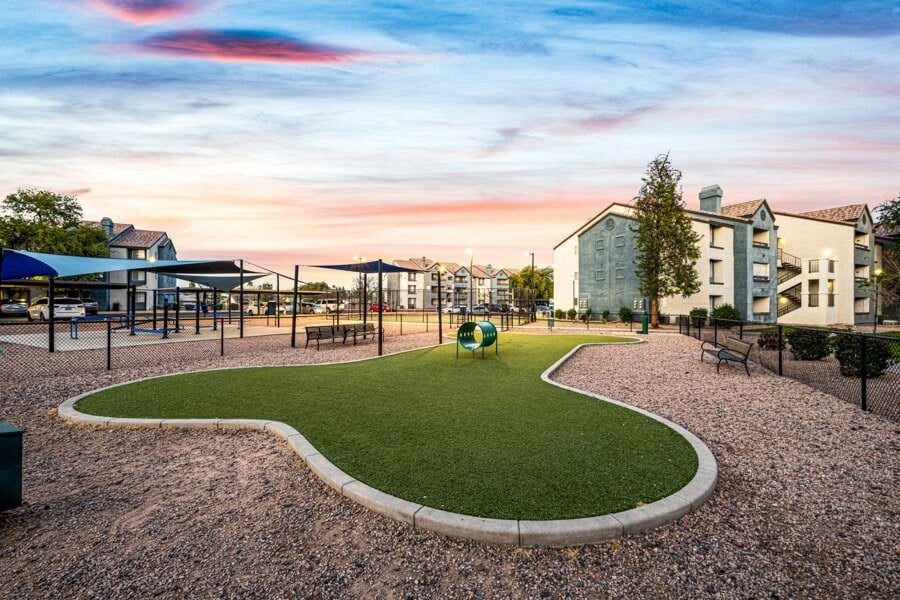 a park with a playground and buildings at sunset at Array South Mountain, Phoenix, AZ, 85044