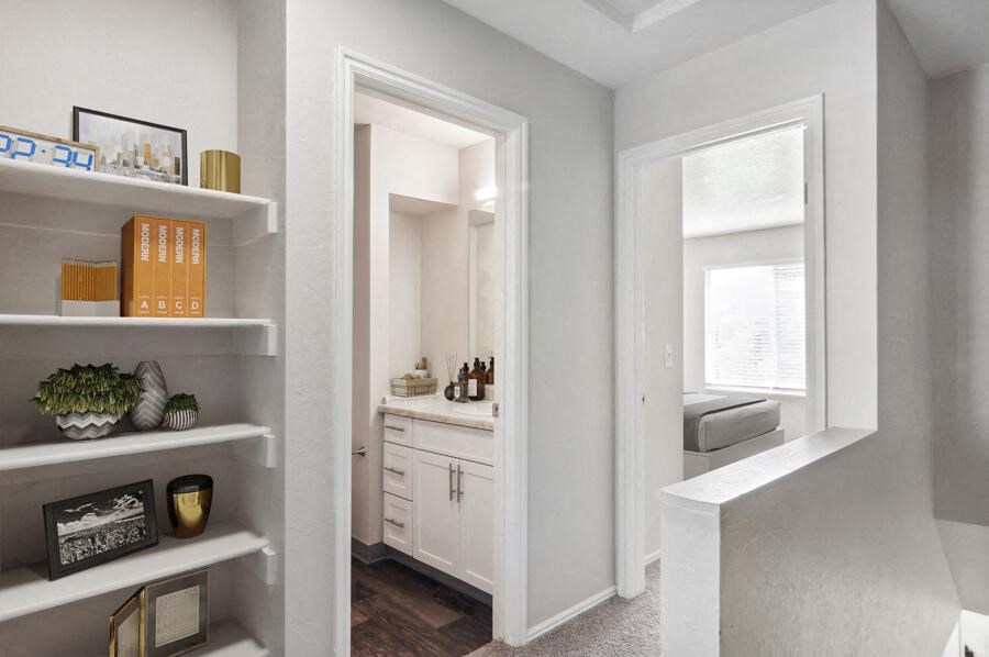 Model bathroom with a sink and a mirror