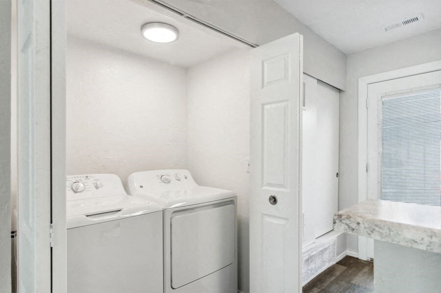 a laundry room with a washer and dryer