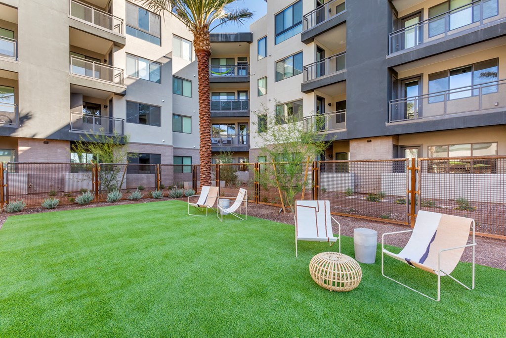 the preserve at ballantyne commons apartments courtyard with chairs and grass