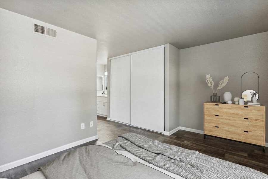 a bedroom with a bed and a dresser