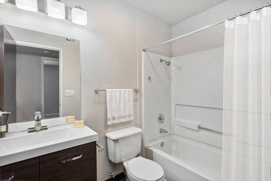 a bathroom with a toilet sink and bathtub