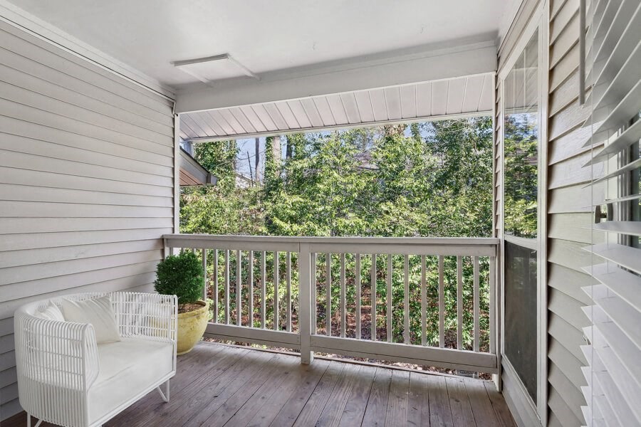 Apartment porch with a white chair