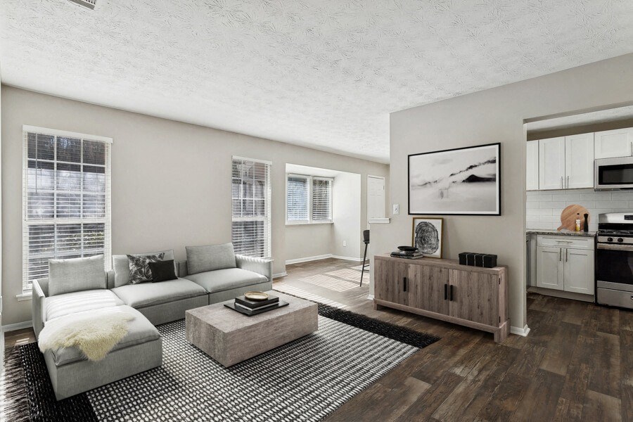 Model apartment living room with a couch and a coffee table