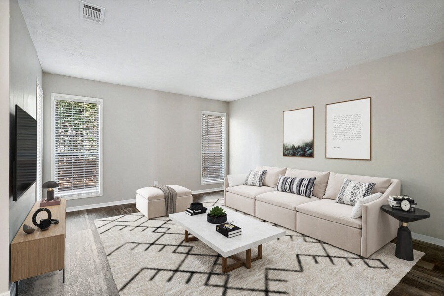 Model living room of an apartment with a couch and a coffee table