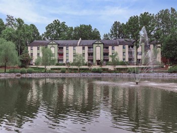 Apartment property pond with fountain and walking path - Photo Gallery 6