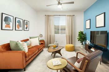a living room with white walls and a blue accent wall