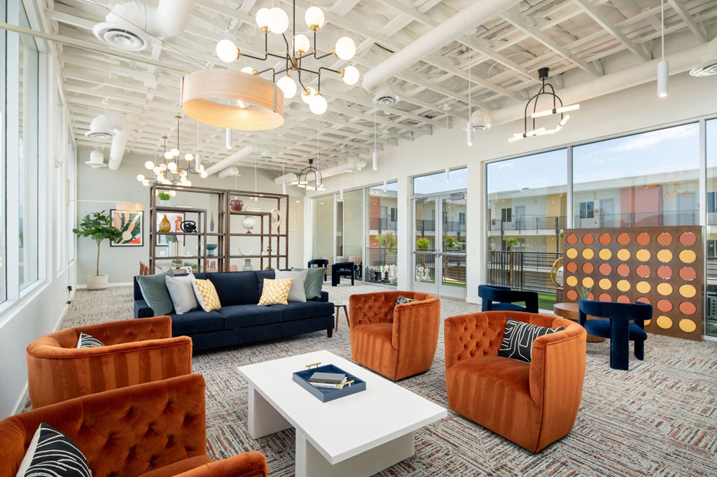 a room filled with furniture and a large window