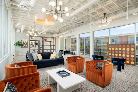 a living room with couches and chairs and a table