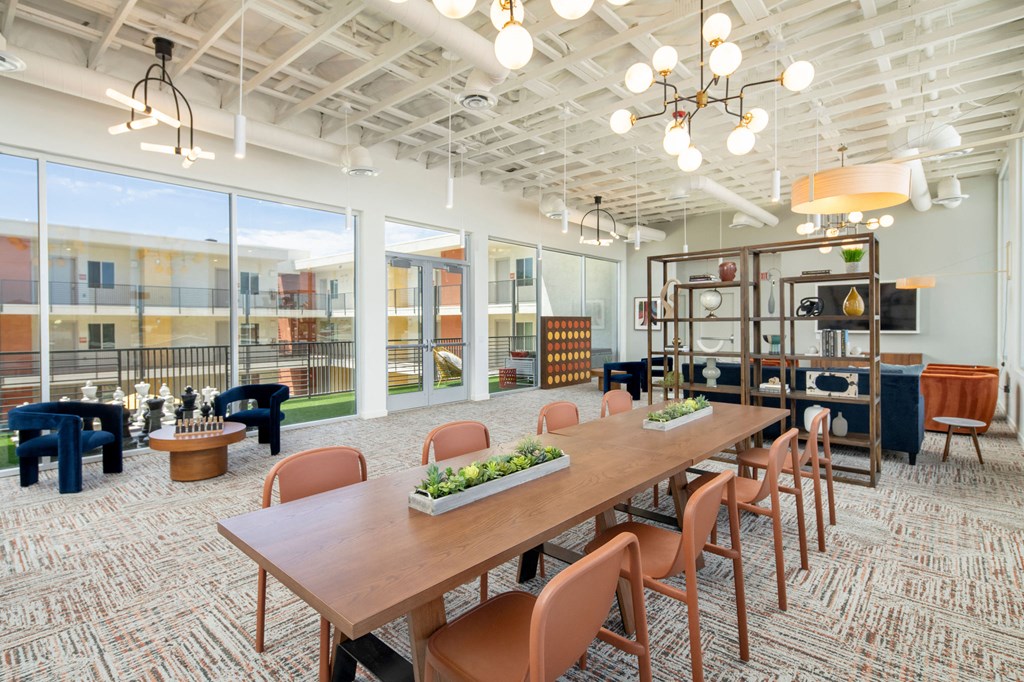 a large room with a long wooden table and chairs