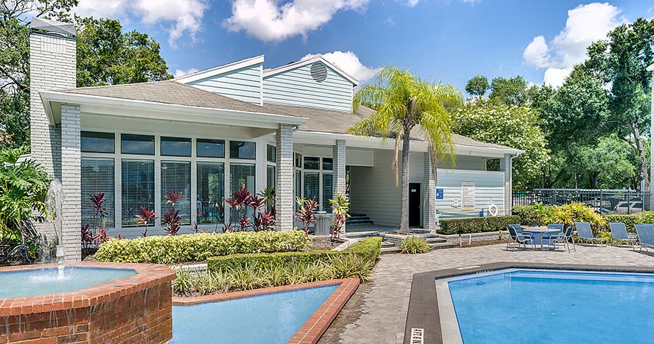 Community pool with the clubhouse in the background