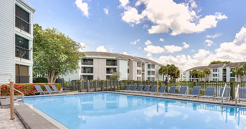 View of the pool, with the apartments in the background